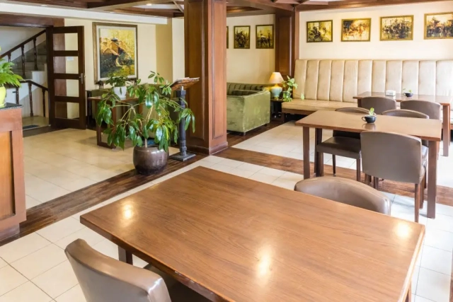 Front desk and sitting area, offering a welcoming space for guests to check in and relax.