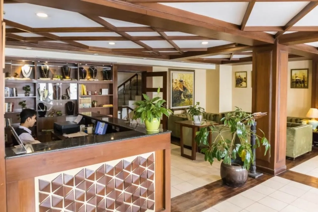 Front desk and sitting area, offering a welcoming space for guests to check in and relax.