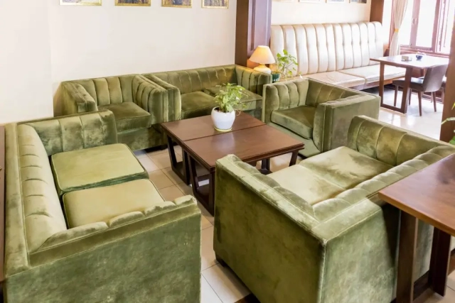 Front desk and sitting area, offering a welcoming space for guests to check in and relax.