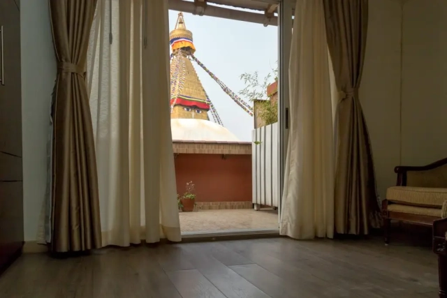 View of the Stupa from the Hotel Padma's Stupa View Suite, showcasing the iconic monument in the background.