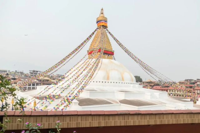 Stupa view from the outside balcony of Hotel Padma's Stupa View Suite, with the monument prominently visible.